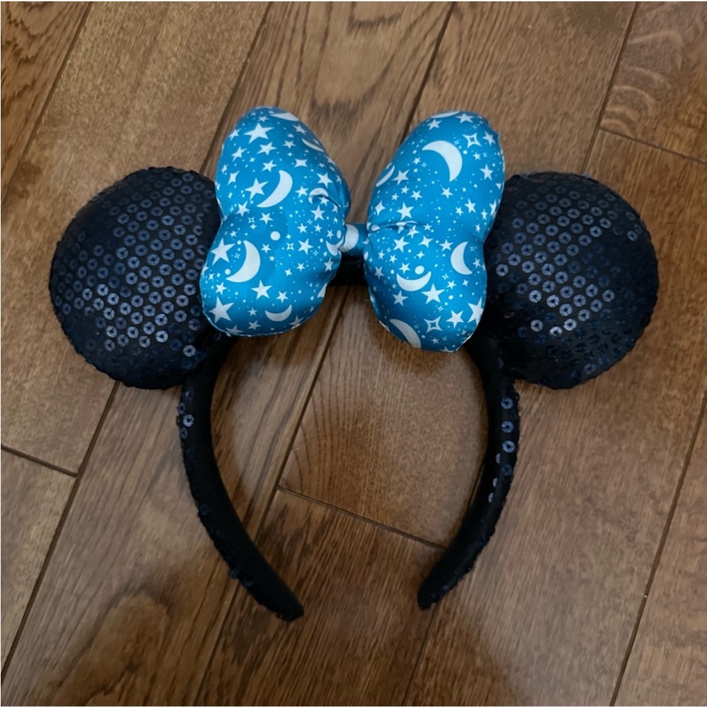 A Disney Parks ears headband photographed for a US resale marketplace listing